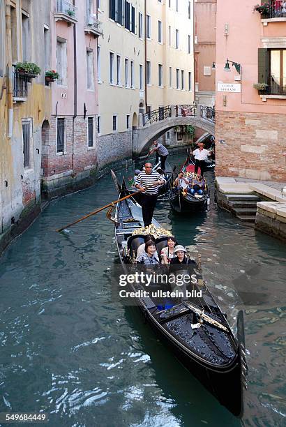 Gondolas on a side canal in Venice.