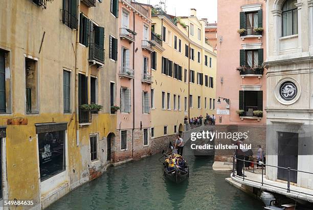 Gondolas on a side canal in Venice.