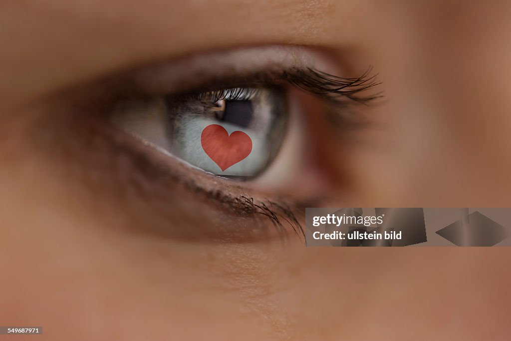 Woman looking at Internet site with a heart