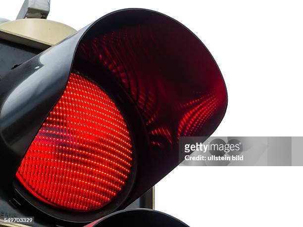 Eine Verkehrsampel zeigt rotes Licht. Symbolfoto für Halt, Ausstieg und Gefahr.