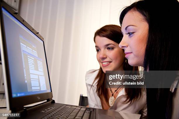 Young woman learning a program on their laptop