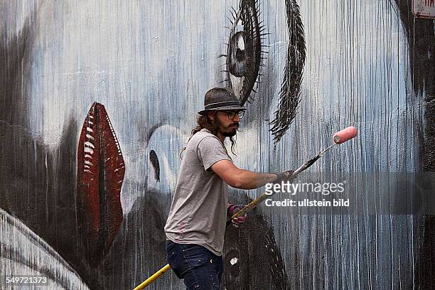 Australian mural painter Rone in Tenderloin District in San Francisco California USA