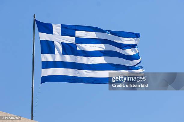 Port Sani, Greece, a Greek national flag is flying in the strong wind