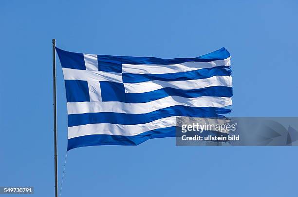 Port Sani, Greece, a Greek national flag is flying in the strong wind