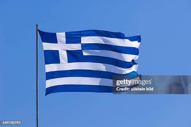 Port Sani, Greece, a Greek national flag is flying in the strong wind