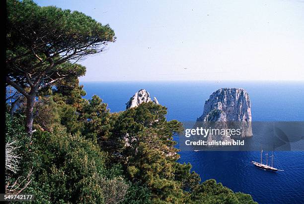 Italy, Capri, Steep coast with sailing boat