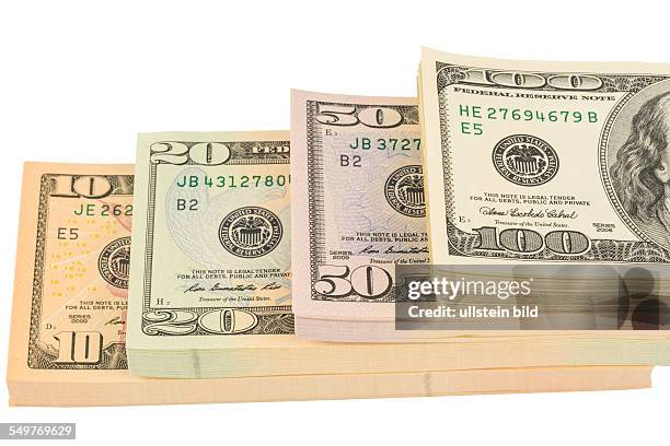 Viele amerikanische Dollar Geldscheine. Symbolfoto für Schulden und Reichtum