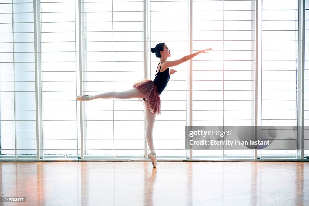 Ballet dancer in studio dancing