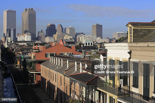 french quarter with downtown in background - downtown new orleans stock pictures, royalty-free photos & images