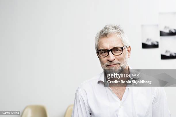 portrait of creative grey haired man with glasses - 50 54 years stock pictures, royalty-free photos & images