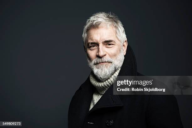 portrait of mature grey haired man in coat - grey beard stock pictures, royalty-free photos & images