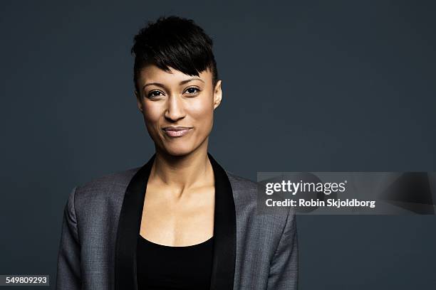 portrait of woman with short hair - black background portrait stock pictures, royalty-free photos & images