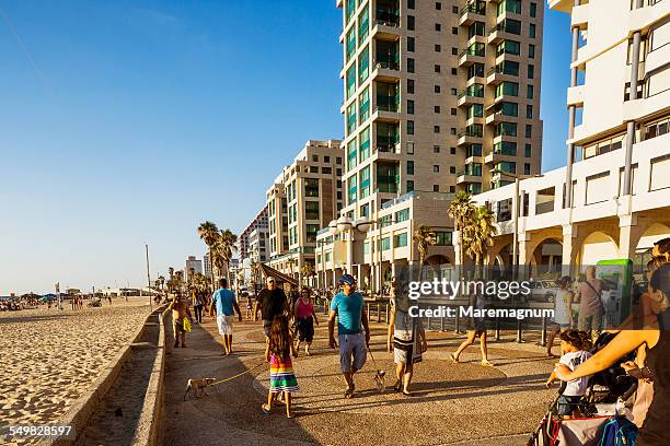 people on the seaside - tel aviv photos et images de collection