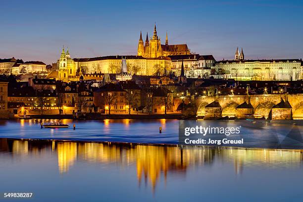 prague at dusk - vltava river stock-fotos und bilder