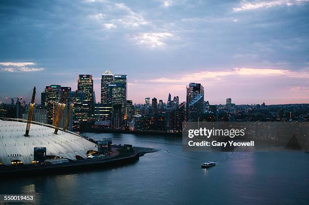 02 arena, canary wharf and city skyline at dusk - dome stock pictures, royalty-free photos & images