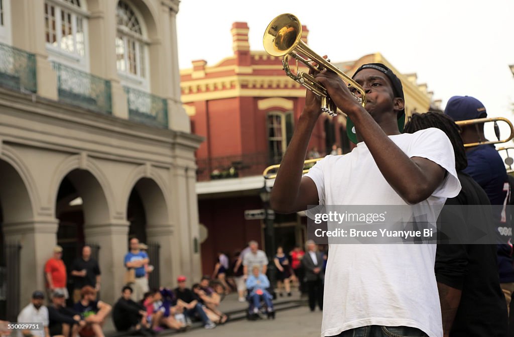 A trumpet player performing on street