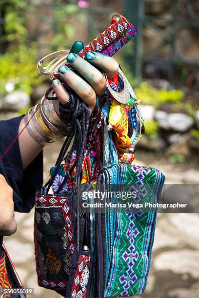 black hmong woman's hand - ストリングブレスレット ストックフォトと画像