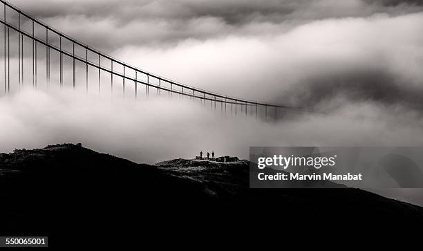 explorers - golden gate bridge city fog stock pictures, royalty-free photos & images