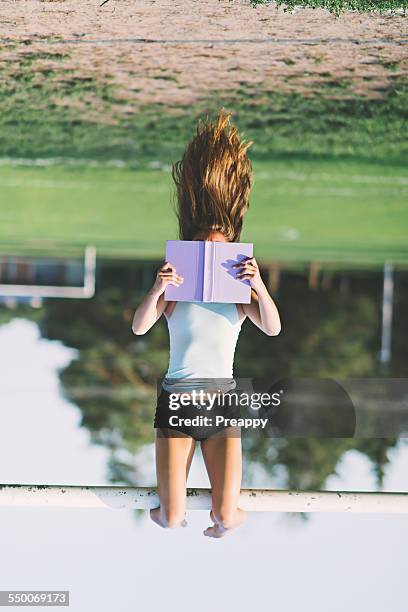 teenage girl reading - girl upside down stock pictures, royalty-free photos & images