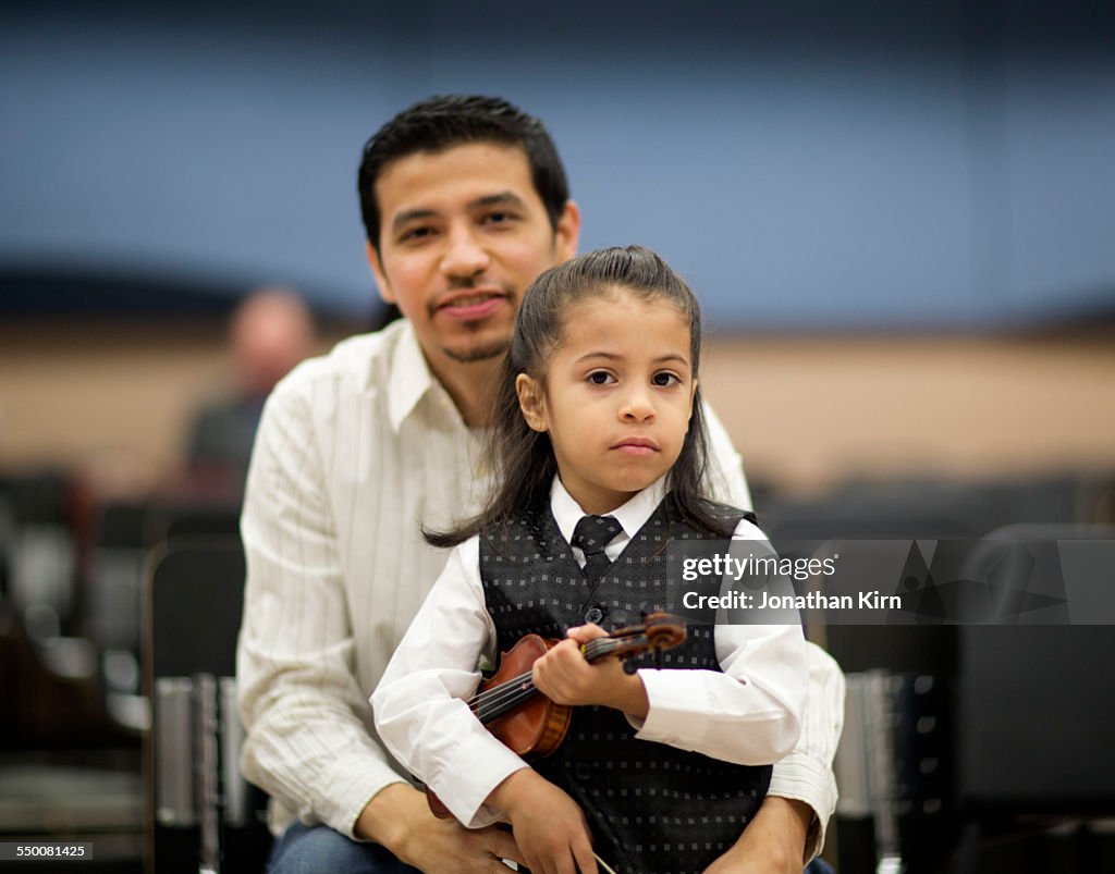 Youth violinist portrait with father