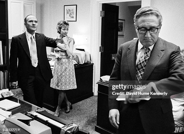 Deputy National Security Advisor Brent Scowcroft and Secretary of State Henry Kissinger discuss when 11 Marines who were stranded on the roof of the...