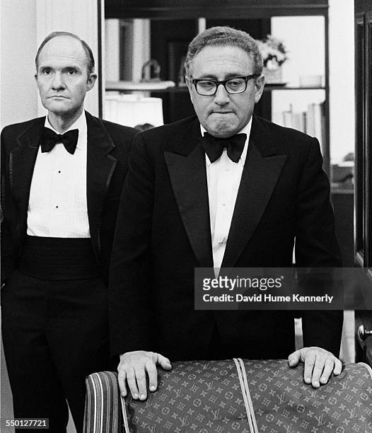 Secretary of State Henry Kissinger and his deputy NSC advisor Brent Scowcroft in their White House Office awaiting news that the last Marines in...