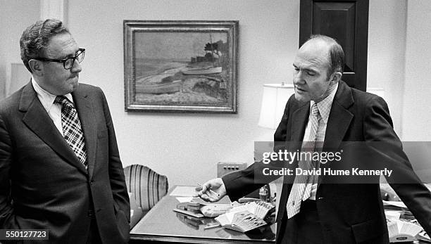 Deputy National Security Advisor Brent Scowcroft tries to explain to his boss Secretary of State Henry Kissinger why 11 Marines were stranded on the...