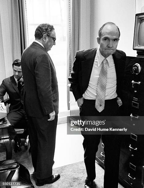 Deputy National Security Advisor Brent Scowcroft, Secretary of State Henry Kissinger, and NSC staffer Robert "Bud" McFarlane in Kissinger's office...