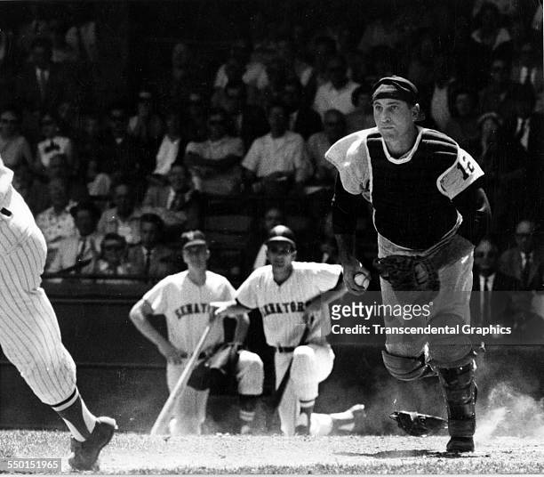 Catcher Joe Pignatano of the Kansas City Athletics in pursuit of a Washington Senators' base runner during an American League game in Griffith...
