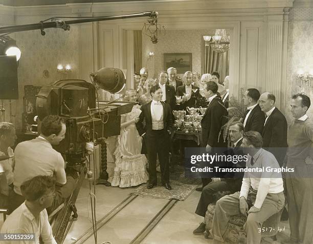 This behind-the-scenes photograph shows a scene shot in a wealthy mansion, Hollywood, California, circa 1940.