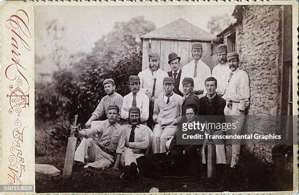 Cabinet photograph, by Clark, shows a cricket team posed in uniform in the countryside, Barre, Vermont, circa 1885.