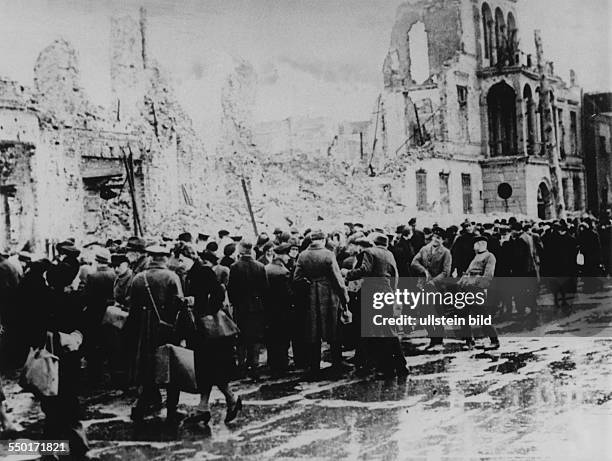 People buying and selling at the black market in the ruins at Leipziger Strasse in East Berlin