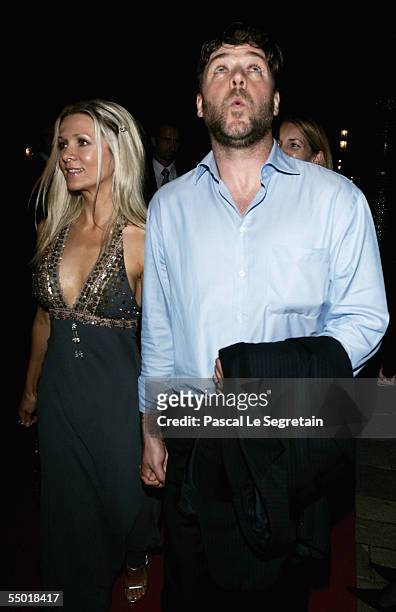 Actor Russell Crowe whistles on his way to work the red carpet with his wife, Danielle Spencer, for the after party for "Cinderella Man" held at the...