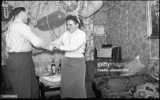 Husband and wife dancing on a party