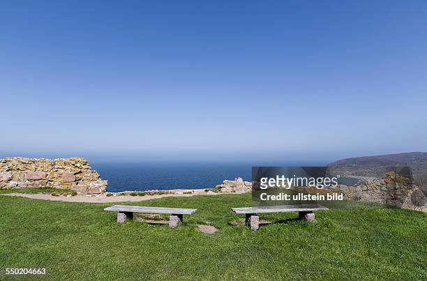 Two benches with view of the Baltic Sea on the castle ruins of Hammershus, Bornholm, Denmark.