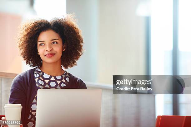 creative businesswoman discussing plans. - pleased laptop fotografías e imágenes de stock