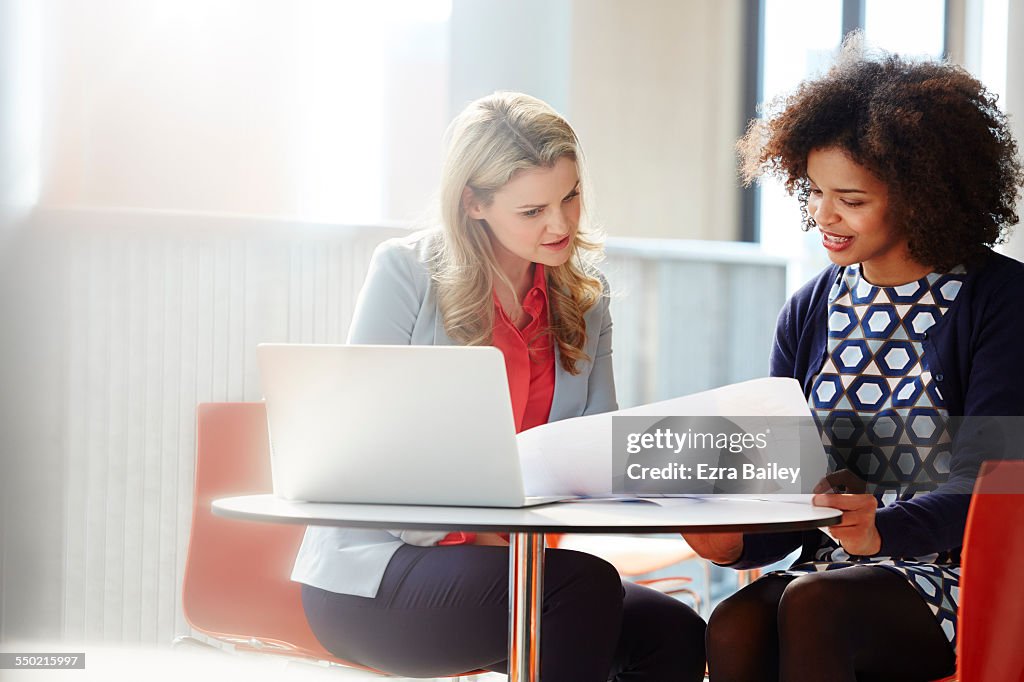 Two businesswomen discussing plans