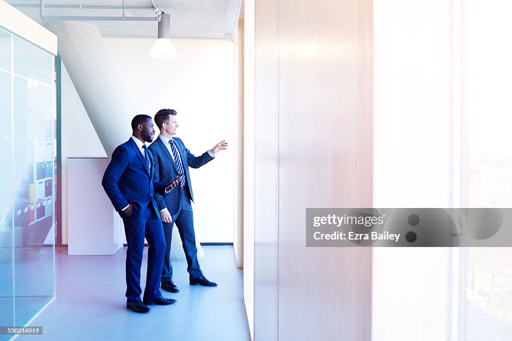 Two businessmen discussing view before meeting