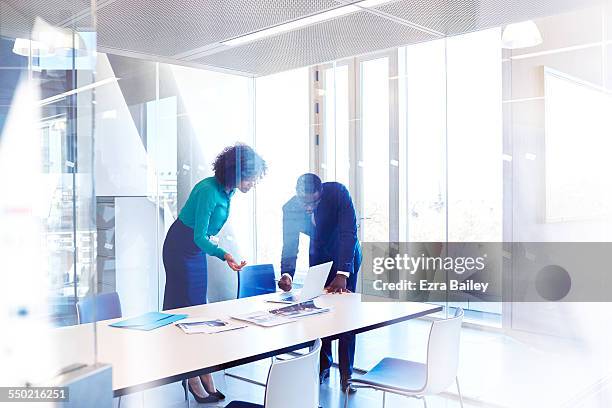 colleagues in meeting room discussing project - meeting man woman bildbanksfoton och bilder