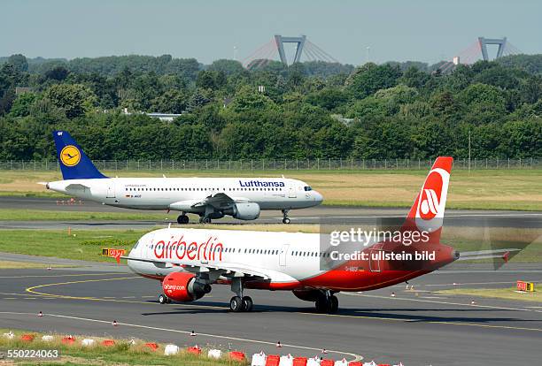 Aircrafts of Lufthansa and Air Berlin on their way to take-off on Duesseldorf airport