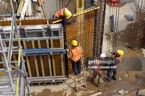 Construction site of a commercial building in downtown Bonn. Reinforcement work on the foundation