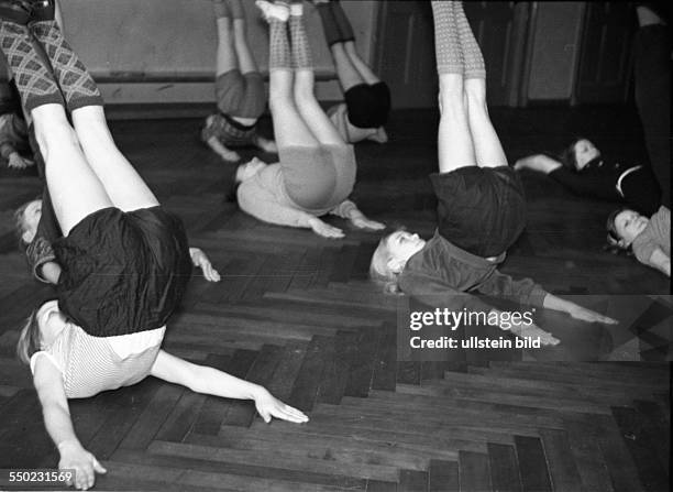 Physical education lesson, children practising in the gym