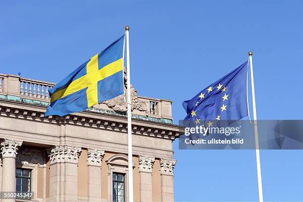 Stockholm. Here: The Europe and Sweden flag fluttering peacefully in front of the Reichstag building