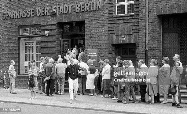 Monetary union of East and West Germany. East Berliners queueing in front of a bank