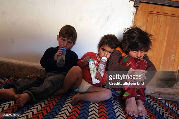 April 27 Yabrud, Rif Dimashq, Syria. Children from a local family whose home has been hit the night before by tank shells are still in shock....