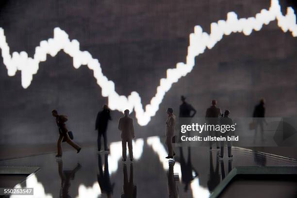 Unkel, the DAX curve from the trading floor of the Frankfurt Stock Exchange with model figures in the foreground