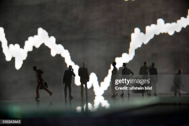 Unkel, the DAX curve from the trading floor of the Frankfurt Stock Exchange with model figures in the foreground