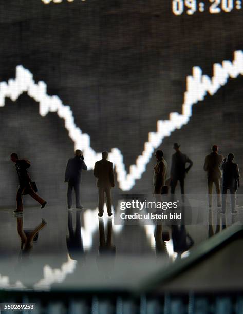 Unkel, the DAX curve from the trading floor of the Frankfurt Stock Exchange with model figures in the foreground