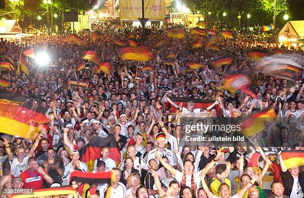 Football fans in Berlin hailing the German football team after winning the third place match against Portugal in the Football World Championship 2006