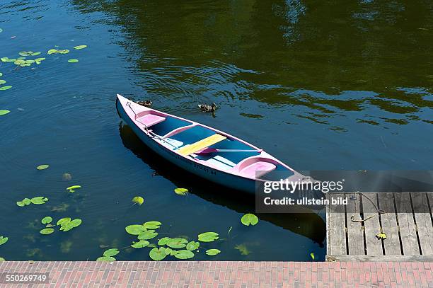 An empty canoe at the boat dock at Hamburg Stadtpark
